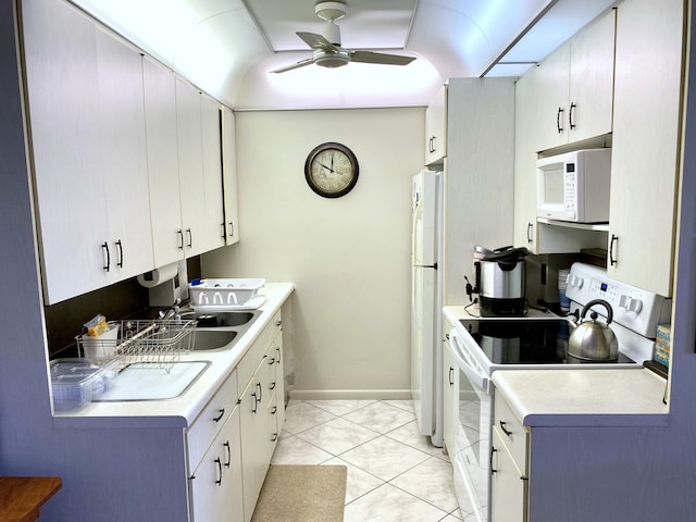 kitchen with light tile floors, ceiling fan, white appliances, and white cabinetry