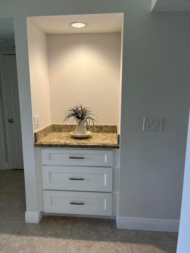 bathroom with vanity and tile floors