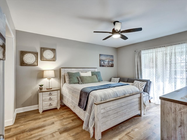 bedroom featuring light hardwood / wood-style floors and ceiling fan