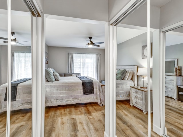 bedroom with light hardwood / wood-style floors and ceiling fan