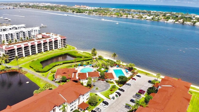 birds eye view of property with a water view