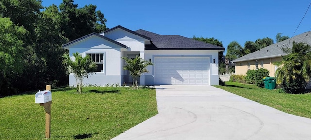 view of front of house with a garage and a front lawn