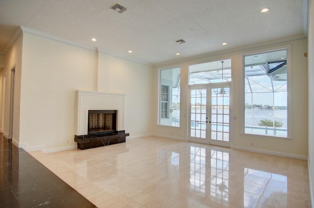 unfurnished living room with plenty of natural light, french doors, a water view, and light tile flooring