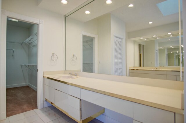 bathroom featuring tile floors and oversized vanity