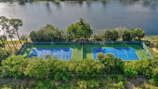 view of sport court with a water view