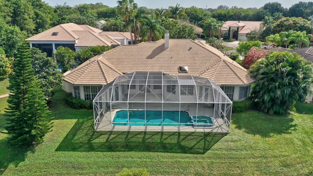 view of pool featuring a lanai and a yard