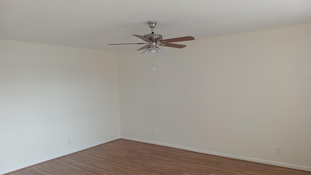 unfurnished room featuring a textured ceiling, ceiling fan, and hardwood / wood-style flooring