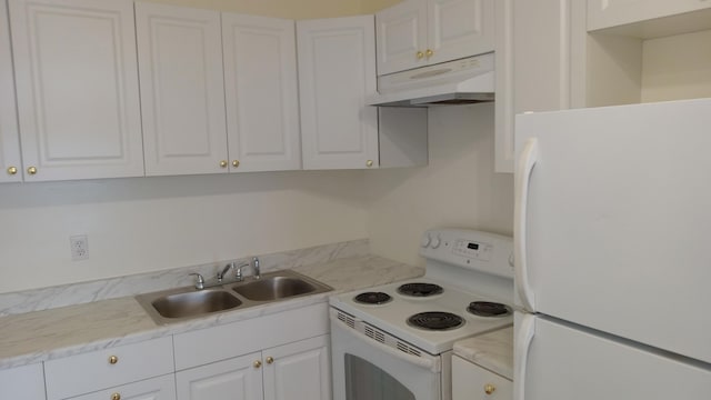 kitchen featuring white appliances, white cabinetry, and sink