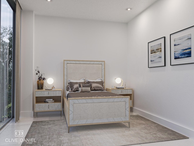 bedroom featuring a textured ceiling and multiple windows