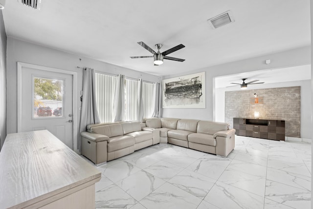 kitchen with ceiling fan, backsplash, white cabinetry, sink, and stainless steel appliances