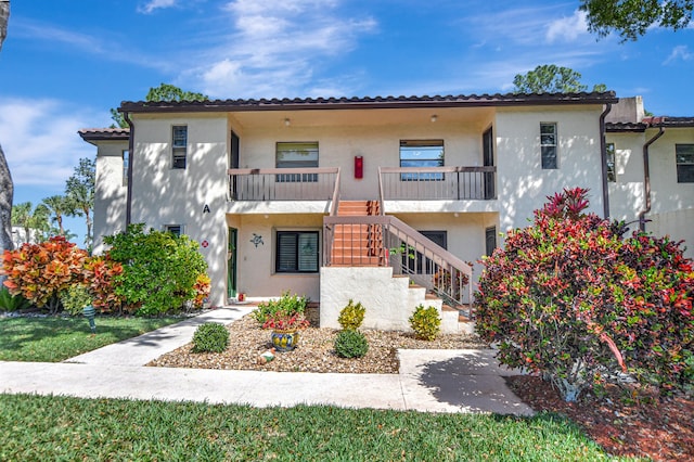 21864 Arriba Real Unit 3D, Boca Raton, FL 33433 - view of front of property with stucco siding and stairway