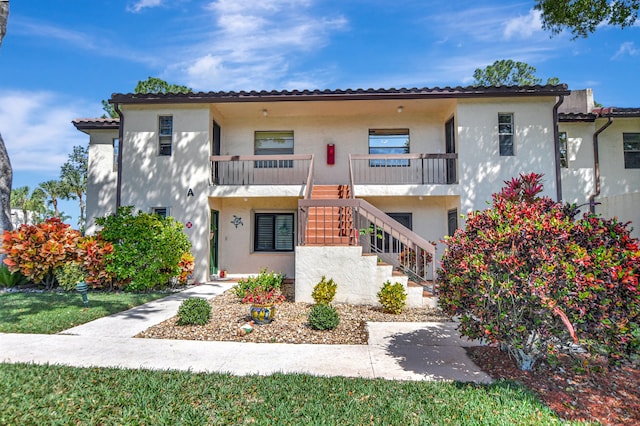 mediterranean / spanish-style home featuring a balcony