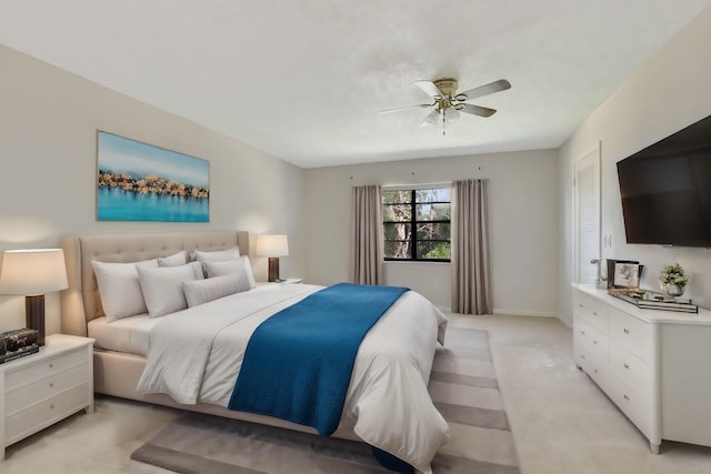 bedroom with light carpet and ceiling fan