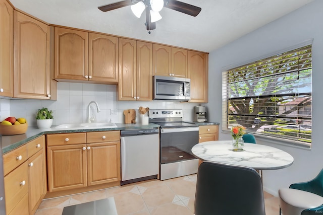 kitchen featuring decorative backsplash, stainless steel appliances, light tile patterned floors, and ceiling fan