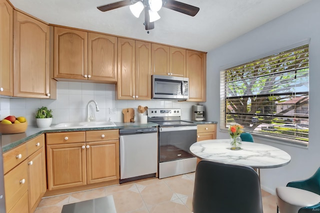 21864 Arriba Real Unit 3D, Boca Raton, FL 33433 - kitchen with decorative backsplash, appliances with stainless steel finishes, light tile patterned flooring, a ceiling fan, and a sink