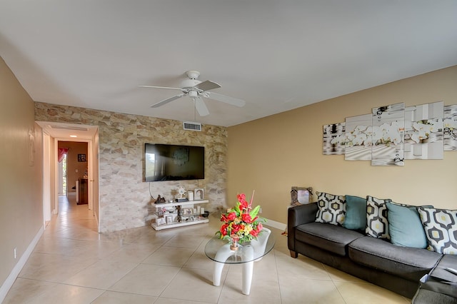 tiled living room with ceiling fan