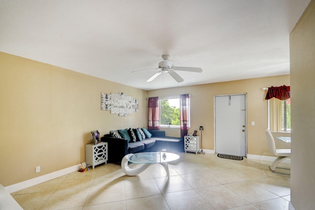 tiled living room featuring ceiling fan