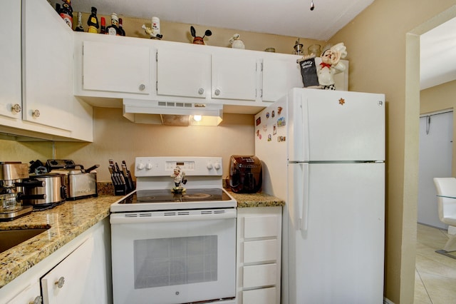 kitchen featuring white cabinets, white appliances, light stone counters, and light tile patterned flooring