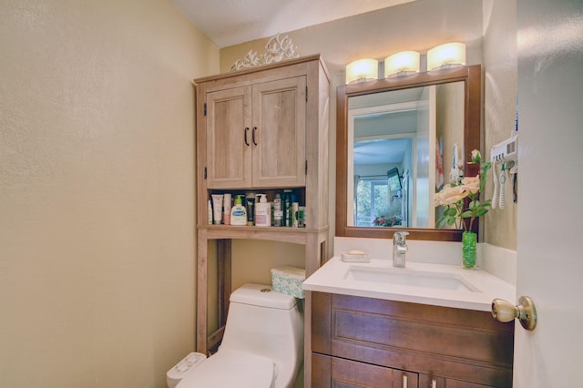 bathroom with vanity and toilet