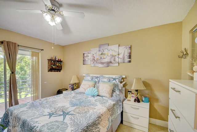 bedroom with light tile patterned floors, ceiling fan, and access to exterior