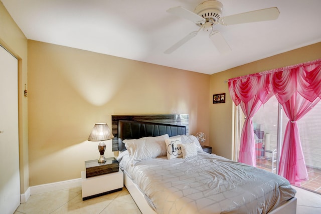 tiled bedroom featuring ceiling fan