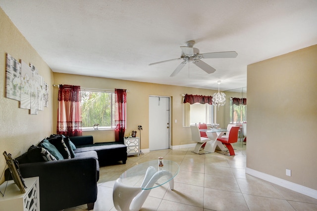 living room featuring ceiling fan and light tile patterned flooring