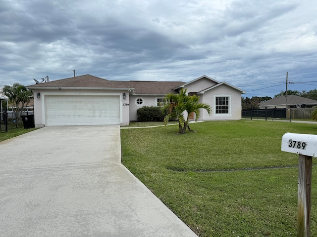 single story home featuring a front yard and a garage