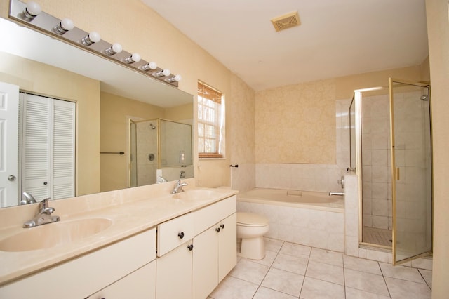 full bathroom with toilet, oversized vanity, separate shower and tub, dual sinks, and tile floors