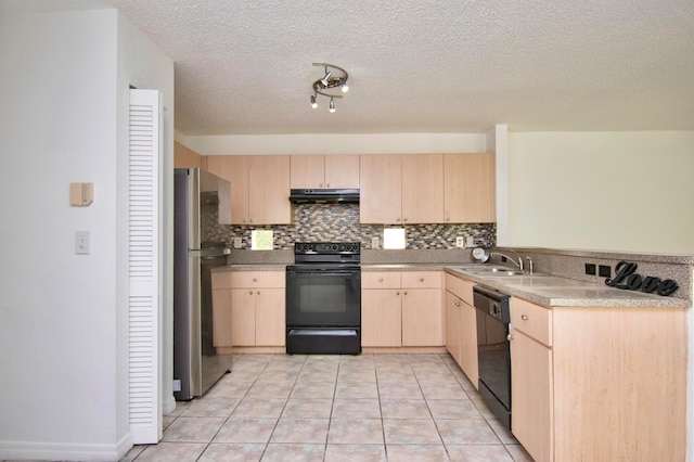 kitchen with light tile floors, light brown cabinets, and black appliances