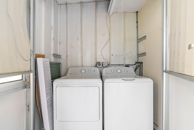 clothes washing area featuring washing machine and clothes dryer