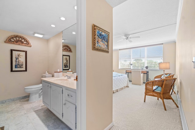 bathroom with oversized vanity, a shower with shower door, toilet, and tile flooring