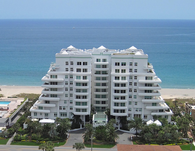 view of property featuring a water view and a view of the beach