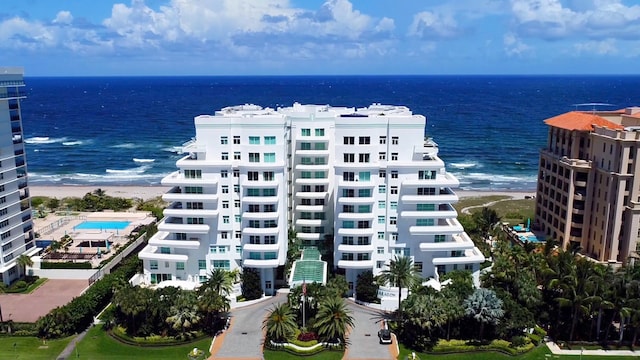 bird's eye view featuring a water view and a view of the beach