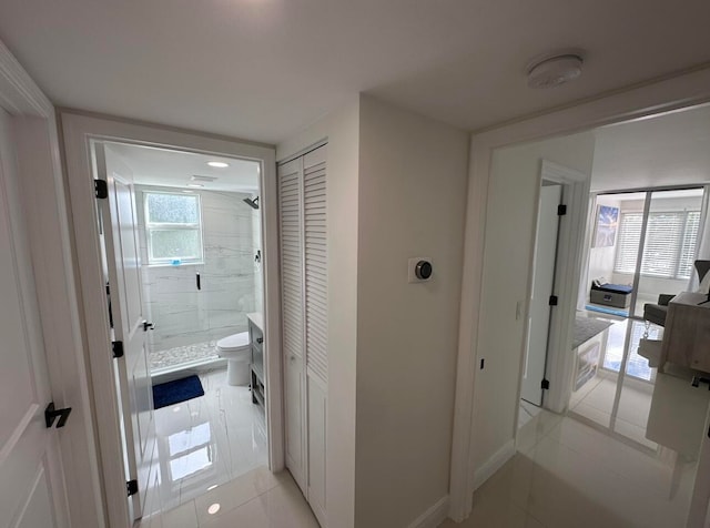 hallway with light tile flooring