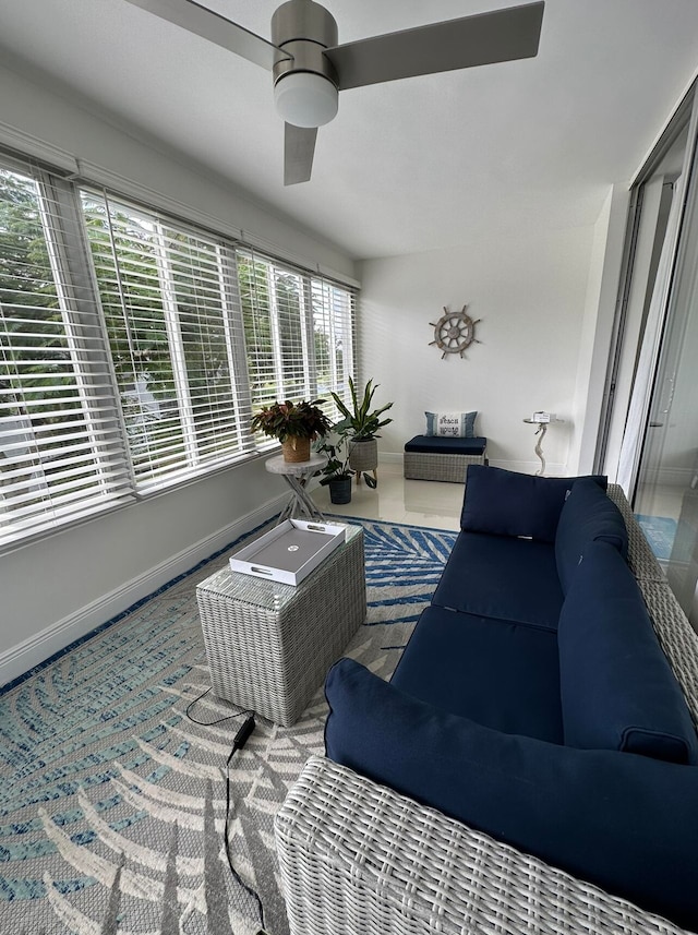 interior space with a healthy amount of sunlight and ceiling fan