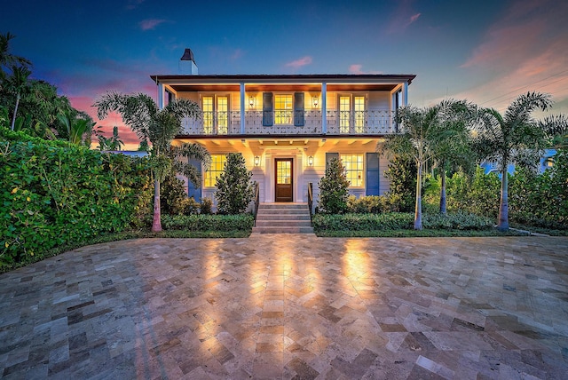 view of front of home with a balcony