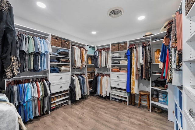 spacious closet featuring hardwood / wood-style floors