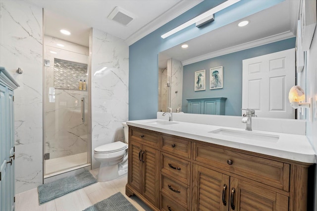 bathroom featuring vanity, toilet, a shower with shower door, and crown molding