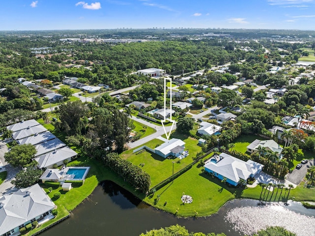 birds eye view of property featuring a water view