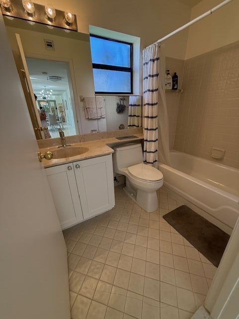 bathroom featuring tile patterned flooring, visible vents, toilet, shower / bath combination with curtain, and vanity