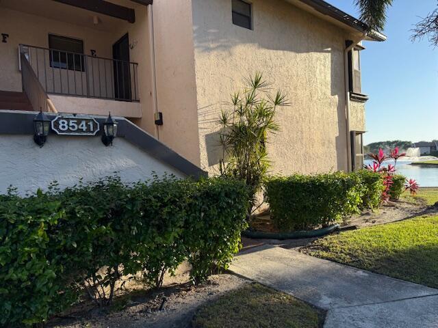 view of side of home featuring stucco siding