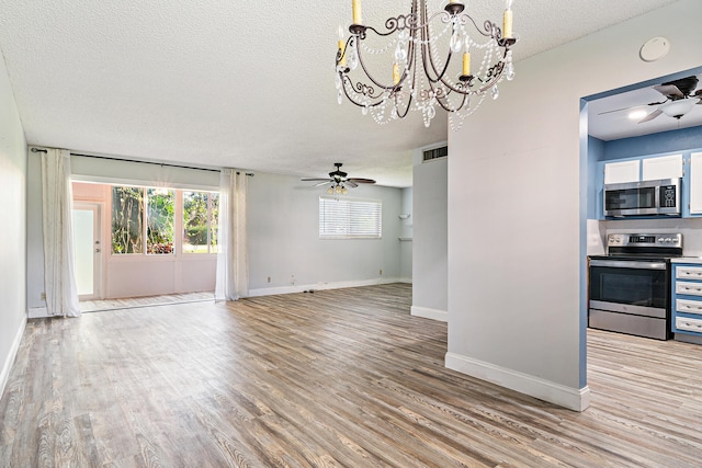 interior space featuring a textured ceiling, light hardwood / wood-style flooring, and ceiling fan with notable chandelier