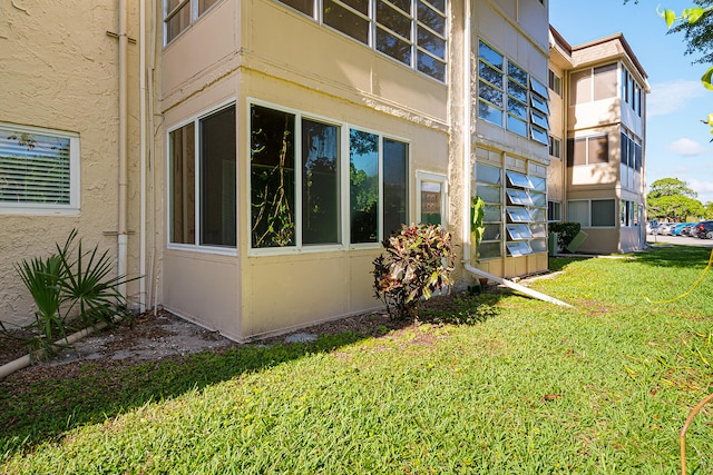 exterior space with a lawn