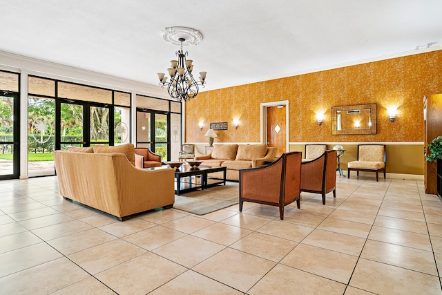 tiled living room featuring ornamental molding, french doors, and a chandelier