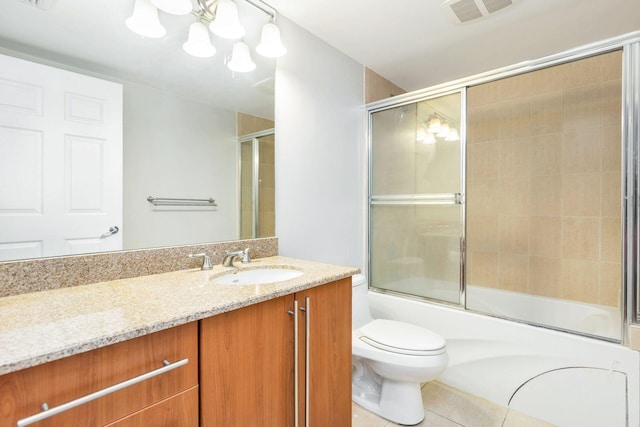 full bathroom featuring toilet, vanity, a chandelier, tile floors, and bath / shower combo with glass door