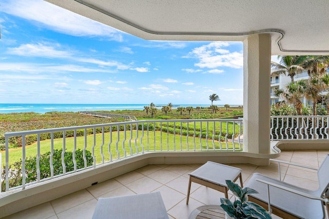 balcony featuring a water view