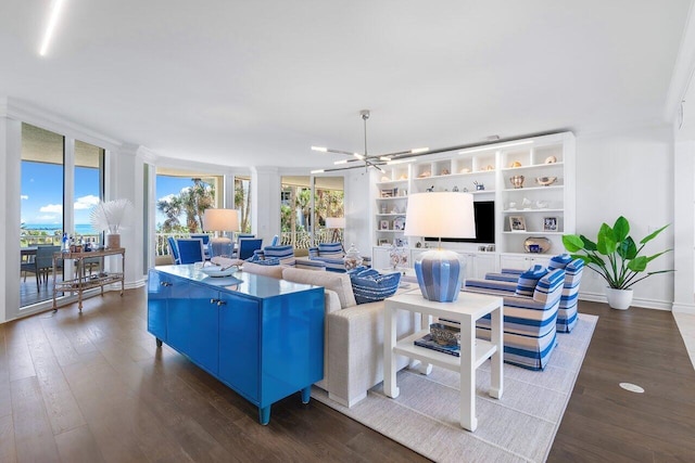 living room featuring hardwood / wood-style floors, ceiling fan, and a wealth of natural light