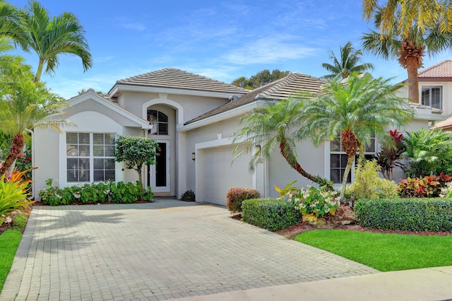 mediterranean / spanish house featuring a garage