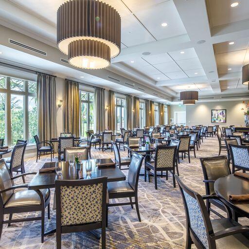 dining space featuring beamed ceiling and coffered ceiling