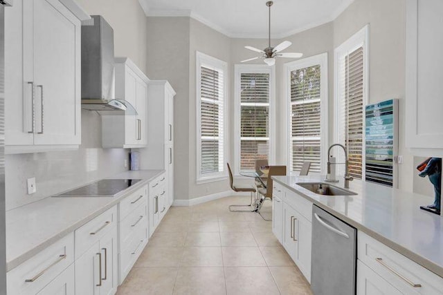 kitchen with a healthy amount of sunlight, dishwasher, white cabinetry, wall chimney exhaust hood, and crown molding